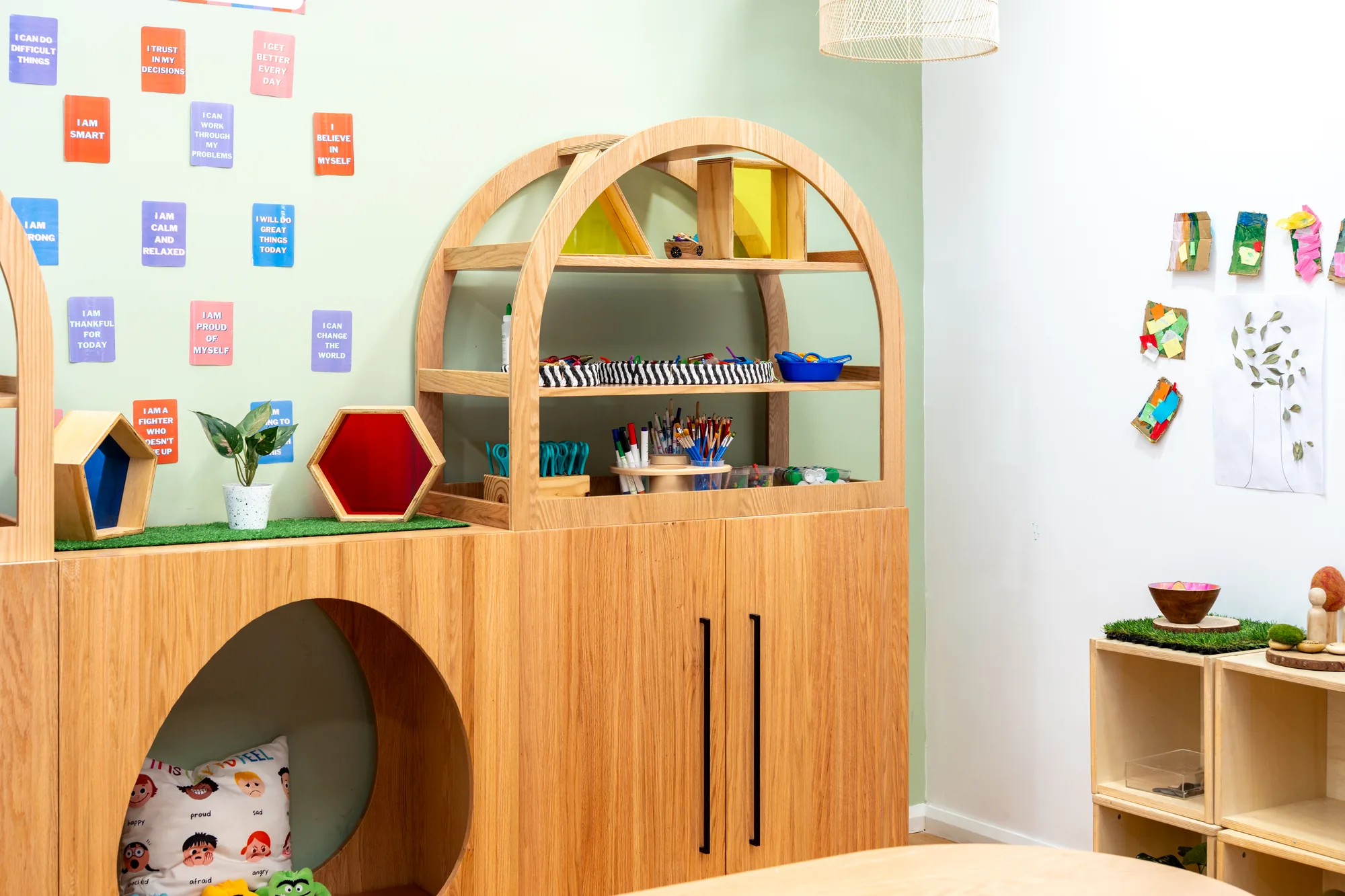 A room at Edensor Park, with the art shelf and a wall of affirmation cards