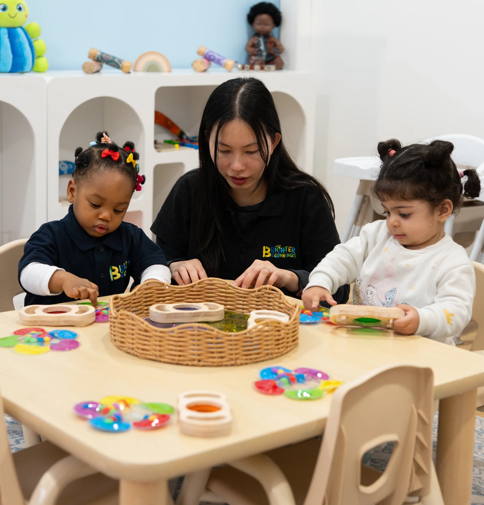 An educator with children in the baby room at Fairfield