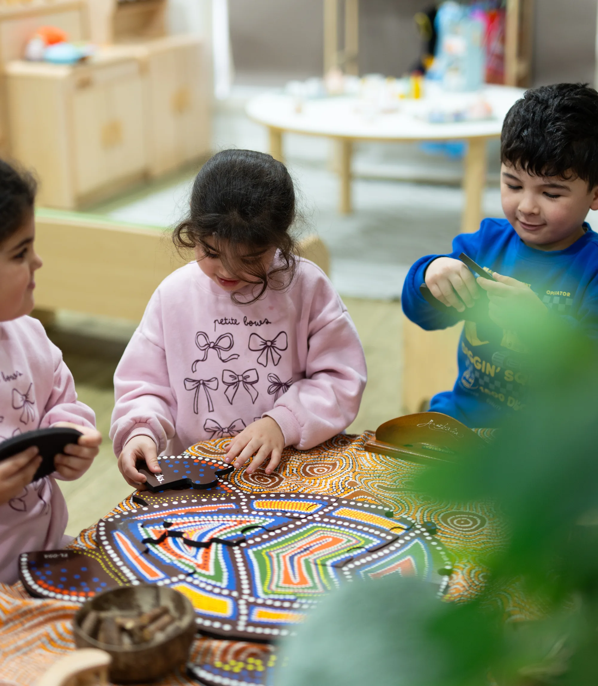 A child working at a table indoors at Fairfield
