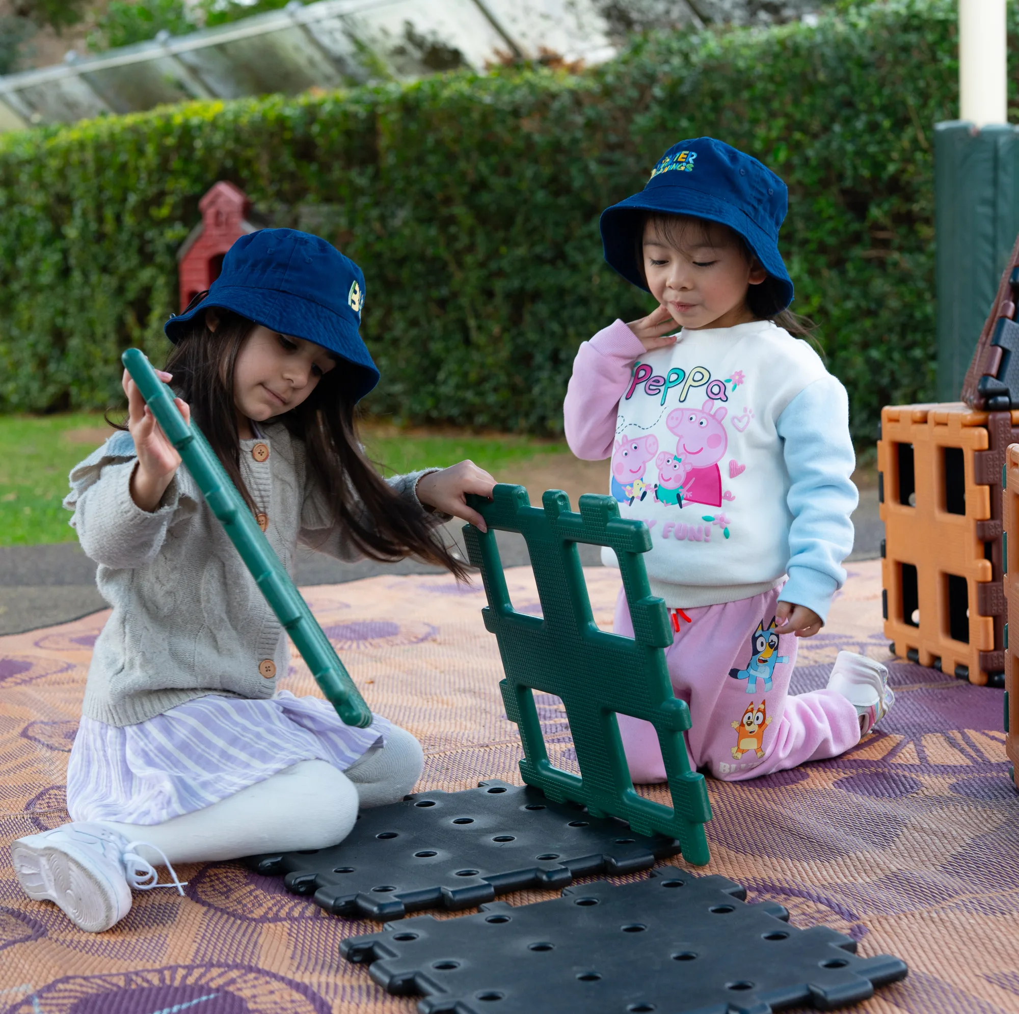 Children playing outdoors in the Daintree yard at Fairfield
