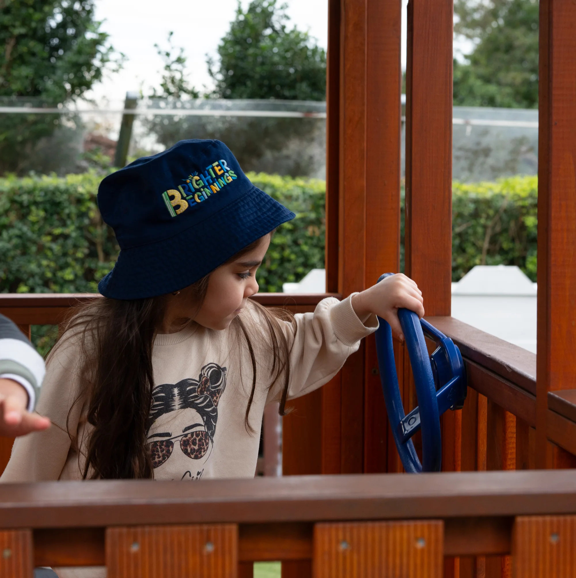 Children playing outdoors in the Daintree yard at Fairfield