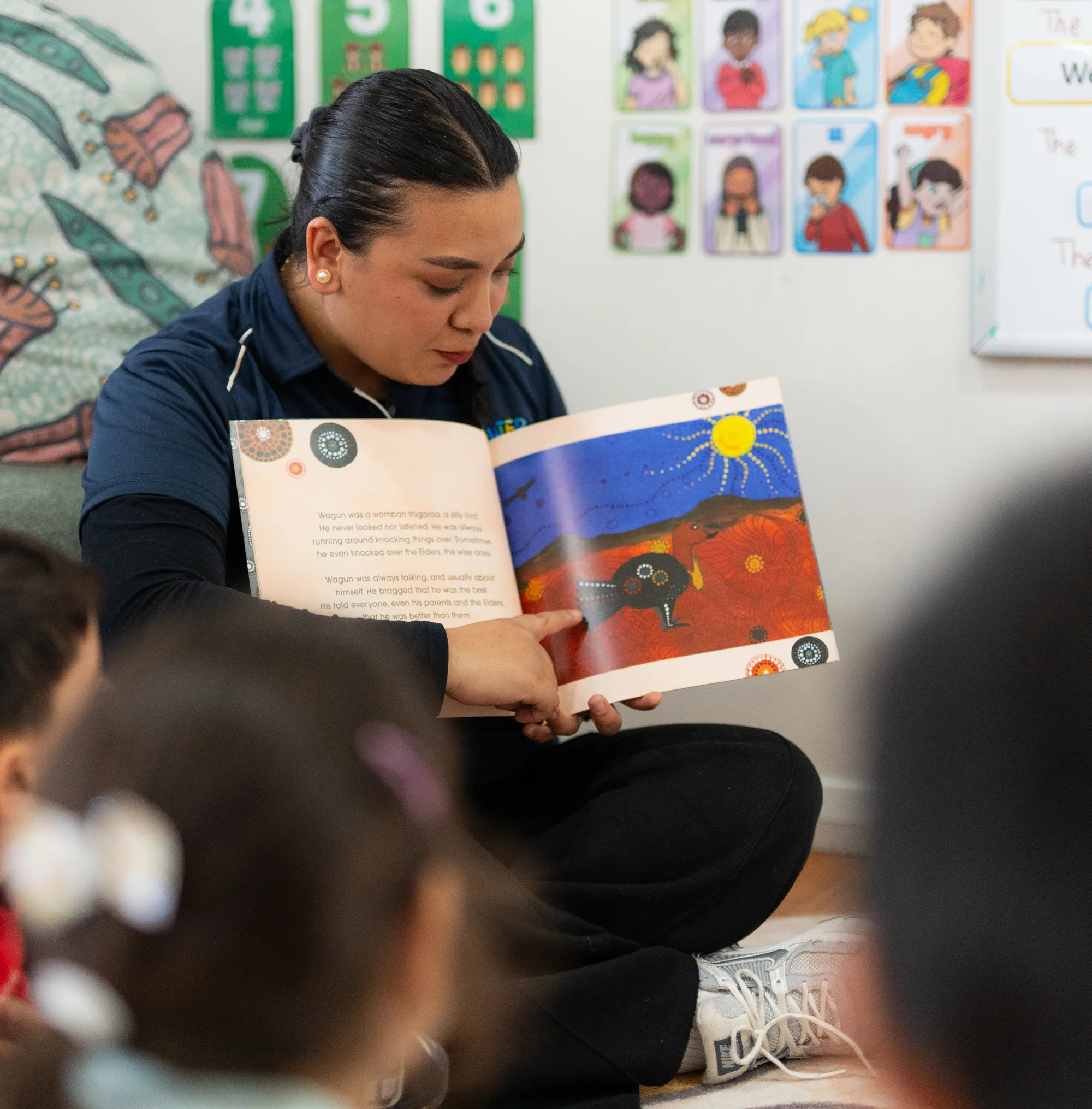 An educator and child working together indoors at Fairfield